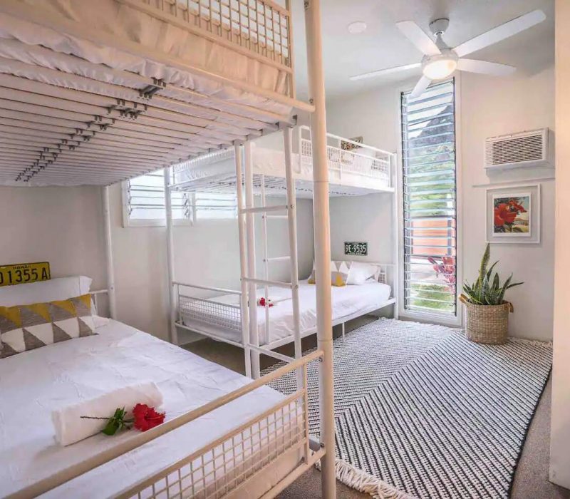 Timber and Love Stay With Us - Chinaman's Ocean Front Beach House Airbnb Guest Bedroom